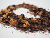 Close up picture of herbal tea with dried apples and hibiscus calyxes