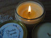 A close up of a lit candle wick